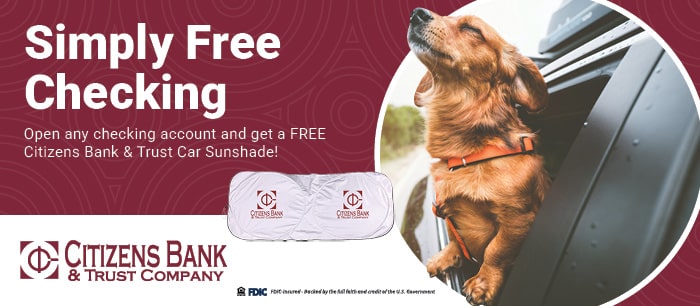 Dog enjoying wind in car promoting Citizens Bank & Trust Company free checking offer with sunshade.